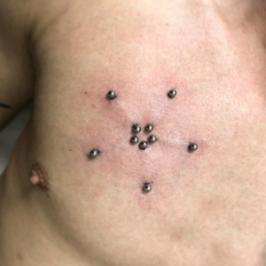 surface chest brust piercing